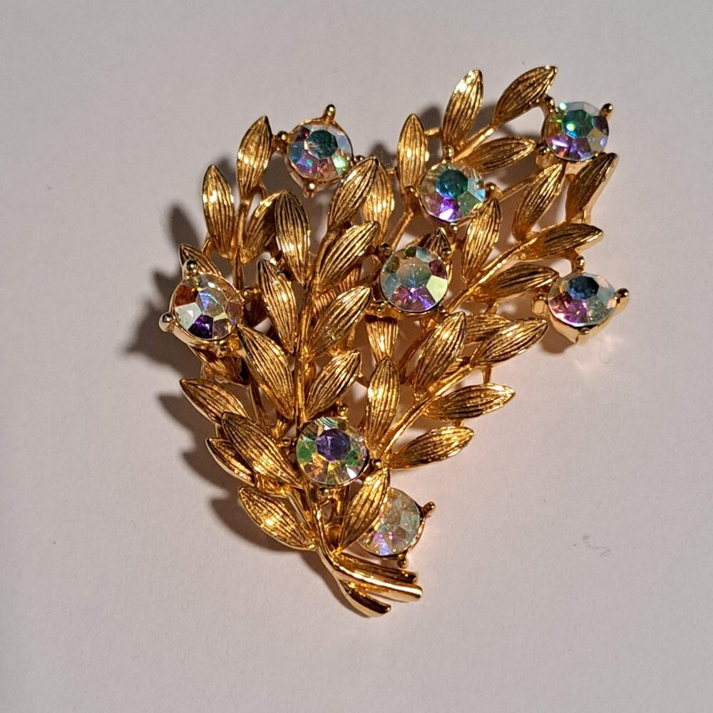 Vintage Prestige gold tone leaf plant brooch with aurora borealis stones